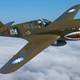 A vintage P-40 warbird in American Volunteer Group (Flying Tigers) livery. The roundels on the wing represent Nationalist China. (Military Aviation Museum)